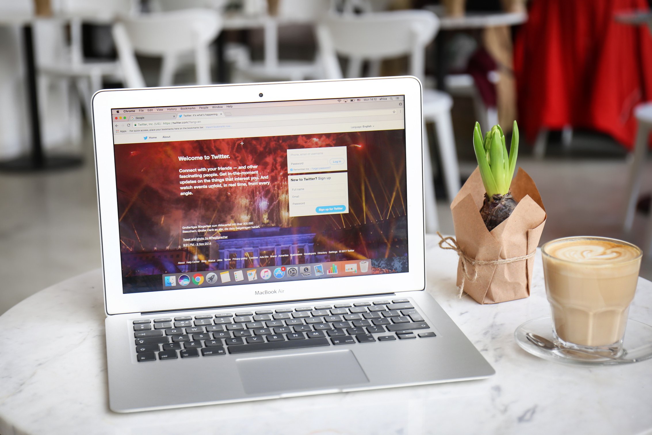 Modern Apple Macbook Air Displaying Twitter Homepage on Screen 